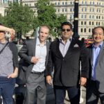 Tanner Laycock with Dennis Yu in a London square near the London Eye