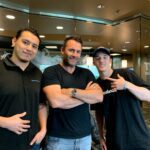 Tanner Laycock with two colleagues in the LightSpeedVT SPEEDVT lobby